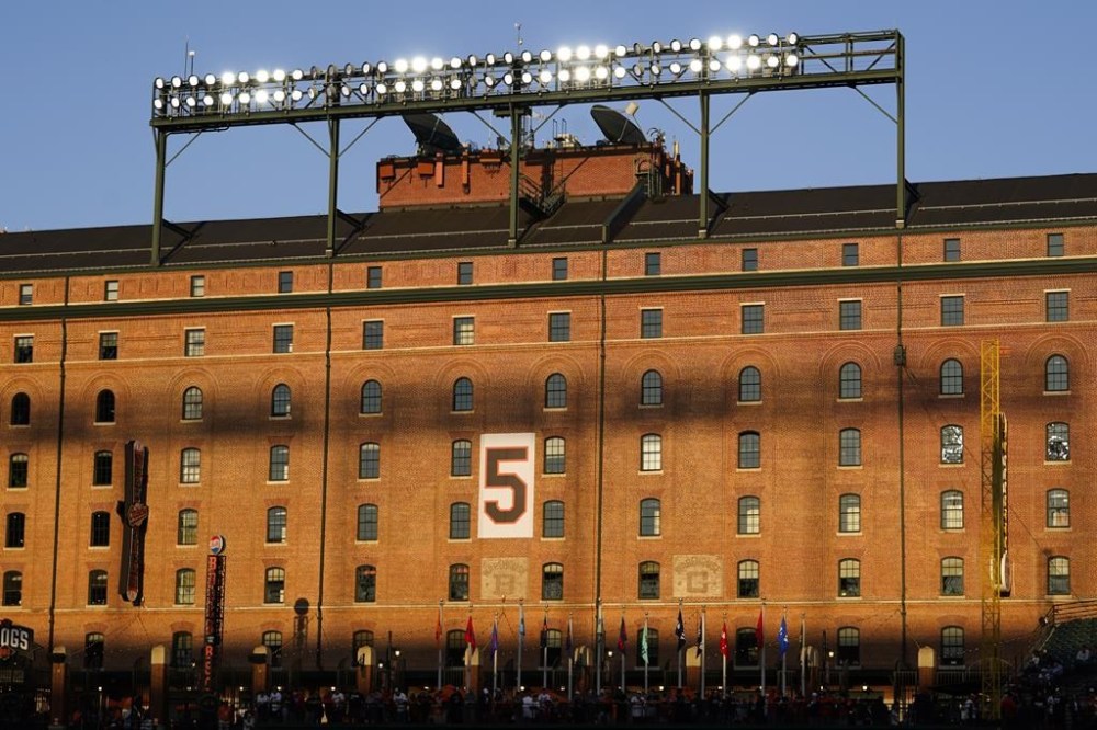 The retired number of Baltimore Orioles Hall of Fame third baseman Brooks Robinson is seen on the wall of the warehouse at Oriole Park at Camden Yards prior to a baseball game between the Orioles and the Washington Nationals, Wednesday, Sept. 27, 2023, in Baltimore. Robinson died on Tuesday at the age of 86. (AP Photo/Julio Cortez)