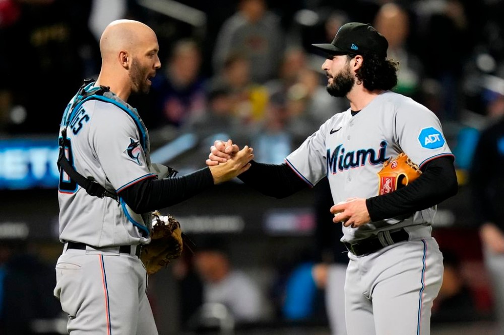 Miami Marlins catcher Jacob Stallings, left, celebrates with relief pitcher Andrew Nardi after the second baseball game of a doubleheader against the New York Mets, Wednesday, Sept. 27, 2023, in New York. (AP Photo/Frank Franklin II)