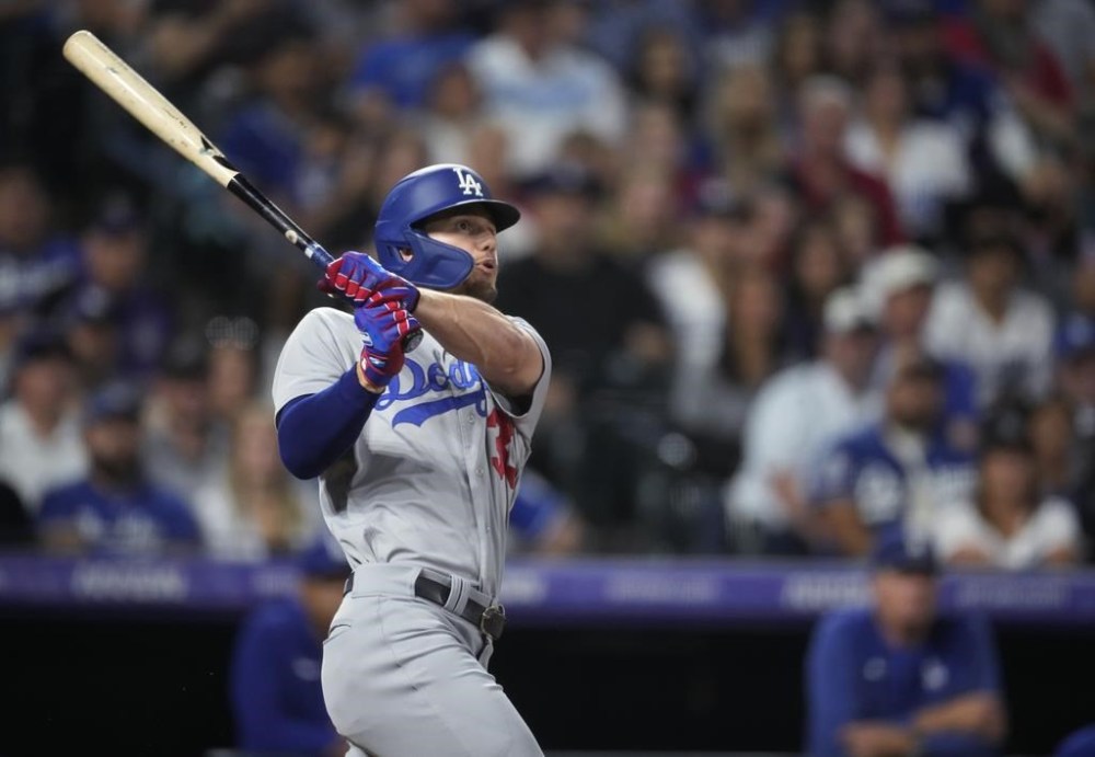 Los Angeles Dodgers' James Outman watches his solo home run off Colorado Rockies starting pitcher Noah Davis during the third inning of a baseball game Wednesday, Sept. 27, 2023, in Denver. (AP Photo/David Zalubowski)