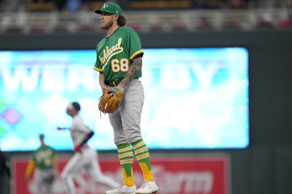 Oakland Athletics starting pitcher Joey Estes stands on the mound after a solo home run by Minnesota Twins' Edouard Julien during the first inning of a baseball game Wednesday, Sept. 27, 2023, in Minneapolis. (AP Photo/Abbie Parr)