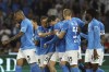 Napoli's Piotr Zielinski, center right, celebrates with teammates after scoring their side's first goal of the game during the Serie A soccer match between Napoli and Udinese at the Diego Armando Maradona stadium in Naples, Italy, Wednesday Sept. 27, 2023. (Alessandro Garofalo/LaPresse via AP)