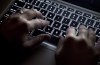 The federal government is coping with apparent cyber attacks this week, as a hacker group in India claims it has sowed chaos in Ottawa. Hands type on a keyboard in Vancouver on Wednesday, December, 19, 2012. THE CANADIAN PRESS/Jonathan Hayward