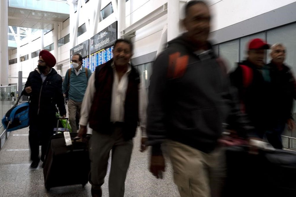 Passengers arrive at Pearson Airport in Toronto on Tuesday, March 14, 2023. In submissions and meetings, industry groups have warned Canada’s transport regulator that sweeping reforms passed in June will put travellers’ safety at risk and drain carriers of cash after a financially devastating COVID-19 pandemic. THE CANADIAN PRESS/Chris Young