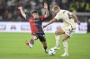 Genoa's Alan matturro, left, and Roma's Rasmus Kristensen battle for the ball during the Serie A soccer match between Genoa and Roma at Luigi Ferraris stadium in Genoa, Italy, Thursday Sept. 28, 2023. (Tano Pecoraro/LaPresse via AP)