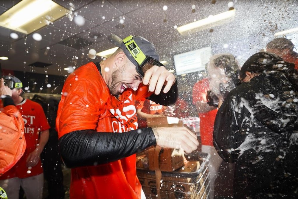 Baltimore Orioles relief pitcher DL Hall celebrates his team's AL East championship following a 2-0 victory over the Boston Red Sox in a baseball game, Thursday, Sept. 28, 2023, in Baltimore. (AP Photo/Julio Cortez)