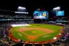Grounds crew members work on the field during a rain delay in a baseball game between the New York Mets and the Miami Marlins early Friday, Sept. 29, 2023, in New York. (AP Photo/Frank Franklin II)