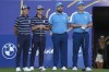 United States' Rickie Fowler, let with playing partner United States' Colin Morikawa pose for a photograph with Europe's Shane Lowry and playing Europe's Sepp Straka, right, on the 1st tee before the start of their morning Foursome match at the Ryder Cup golf tournament at the Marco Simone Golf Club in Guidonia Montecelio, Italy, Friday, Sept. 29, 2023. (AP Photo/Andrew Medichini)