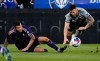 Orlando City SC defender Kyle Smith, left, and CF Montreal defender Aaron Herrera collide during first half MLS action in Montreal, Saturday, May 6, 2023. A rare road victory against Orlando City SC on Saturday evening could go a long way in securing a playoff spot for CF Montreal.THE CANADIAN PRESS/Allen McInnis