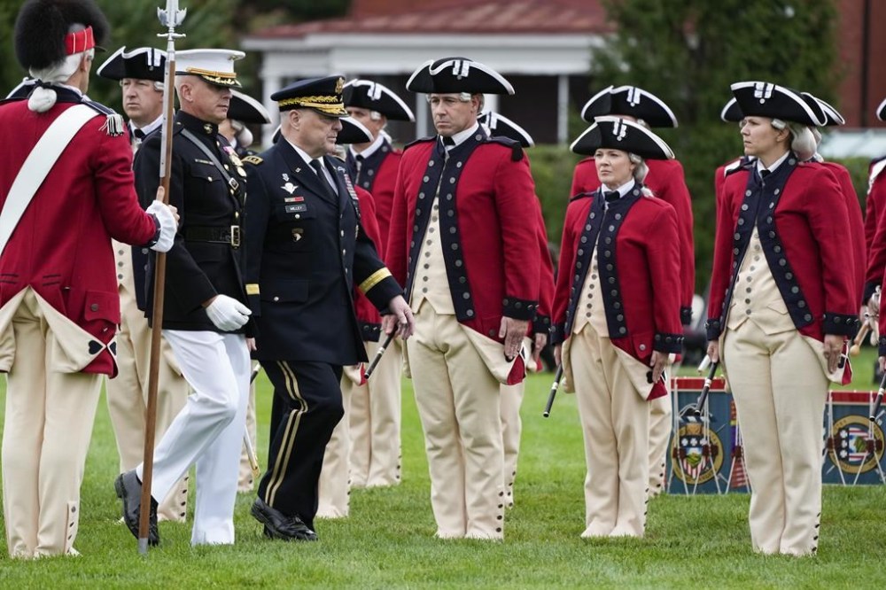 Col. Robert Sucher, Commander 8th and I, Marine Barracks Washington and retiring Joint Chiefs Chairman Gen. Mark Milley, walk during an inspection of the troops at the Armed Forces Farewell Tribute in honor of Milley at Joint Base Myer–Henderson Hall, Friday, Sept. 29, 2023, in Fort Meyer, Va. Also held was an Armed Forces Hail in honor of Gen. CQ Brown, Jr., who the Senate confirmed as the next chairman of the Joint Chiefs of Staff. (AP Photo/Manuel Balce Ceneta)