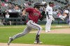 Arizona Diamondbacks' Corbin Carroll runs after hitting a two-run double during the third inning of a baseball game against the Chicago White Sox in Chicago, Wednesday, Sept. 27, 2023. (AP Photo/Nam Y. Huh)