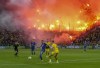 Dortmund fans burn bengals during a German Bundesliga soccer match between TSG 1899 Hoffenheim and Borussia Dortmund in Sinsheim, Germany, Friday, Sept.29, 2023. (AP Photo/Michael Probst)