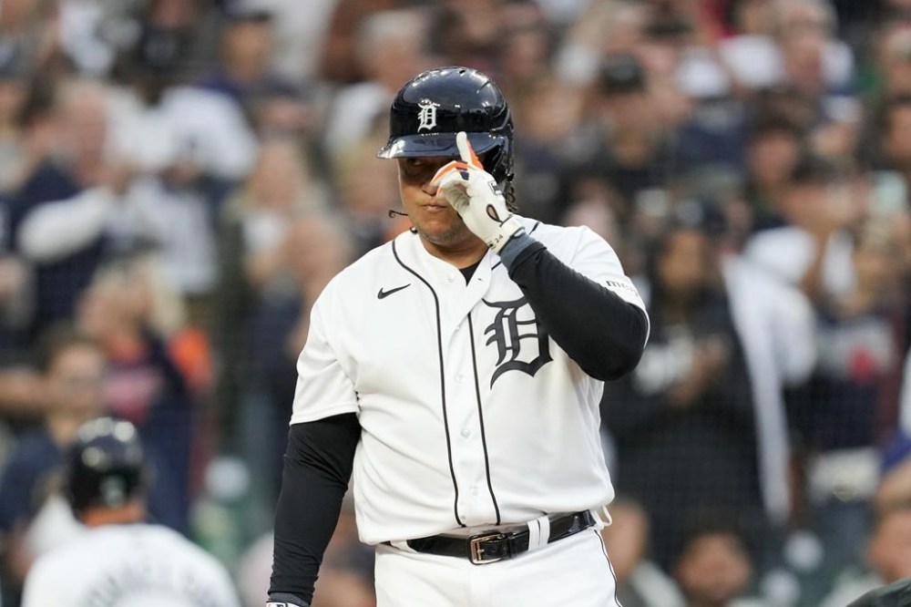 Detroit Tigers' Miguel Cabrera tips his hat towards the Cleveland Guardians dugout and manager Terry Francona in the first inning of a baseball game, Friday, Sept. 29, 2023, in Detroit. (AP Photo/Paul Sancya)
