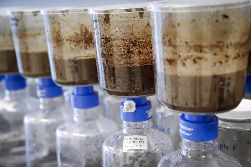 Documents filed by Imperial Oil Ltd. show the company and Alberta's energy regulator knew the Kearl oilsands mine was seeping tailings into groundwater years before a pool of contaminated fluid was reported on the surface, alarming area First Nations and triggering three investigations. Tailings samples are being tested during a tour of Imperial Oil's oilsands research centre in Calgary, Tuesday, Aug. 28, 2018. THE CANADIAN PRESS/Jeff McIntosh