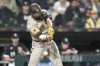 San Diego Padres' Xander Bogaerts hits an RBI sacrifice fly off Chicago White Sox starting pitcher Dylan Cease during the fifth inning of a baseball game Friday, Sept. 29, 2023, in Chicago. (AP Photo/Charles Rex Arbogast)