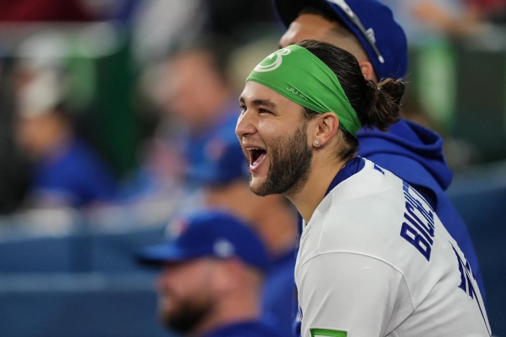 Toronto Blue Jays shortstop Bo Bichette sits in the dug out as he watches the ninth innings of his his team's 11-4 win over Tampa Bay Rays in American League MLB baseball action in Toronto, Friday, Sept. 29, 2023. THE CANADIAN PRESS/Chris Young