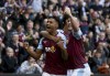 Aston Villa's Ollie Watkins, left, celebrates scoring his third goal of the game during their English Premier League soccer match against Brighton at Villa Park, Birmingham, England, Saturday, Sept. 30, 2023. (Barrington Coombs/PA via AP)