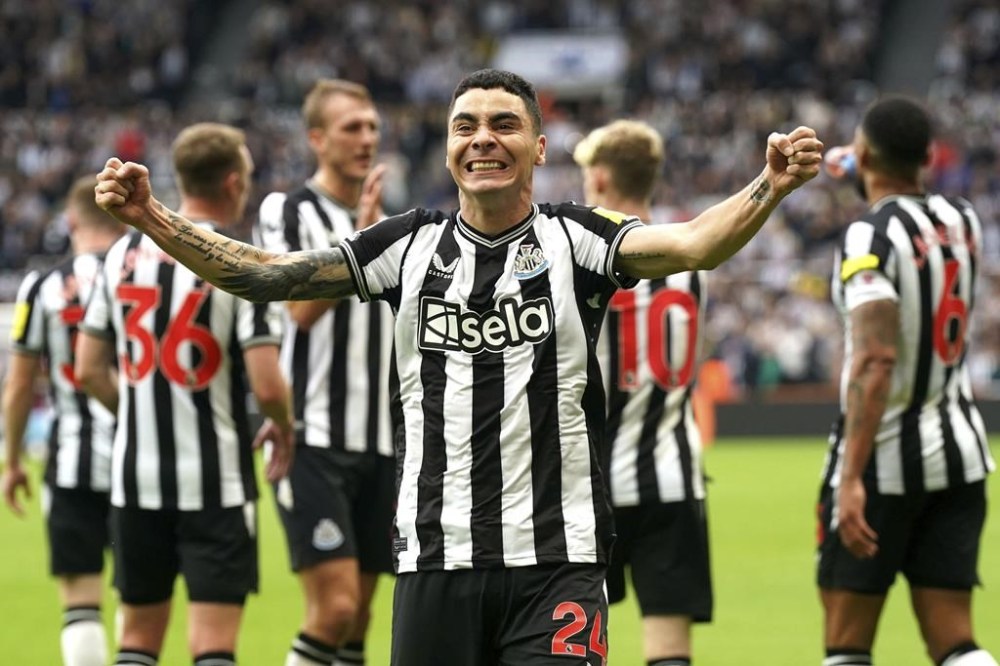 Newcastle United's Miguel Almiron celebrates scoring during the English Premier League soccer match between Newcastle United and Burnley at St. James' Park, Newcastle, England, Saturday Sept. 30, 2023. (Owen Humphreys/PA via AP)