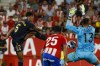 Girona's goalkeeper Paulo Gazzaniga, right, makes a save in front of Real Madrid's Jude Bellingham, left, during a Spanish La Liga soccer match between Girona and Real Madrid, at the Montilivi stadium in Girona, Spain, Saturday, Sept. 30, 2023. (AP Photo/Joan Monfort)