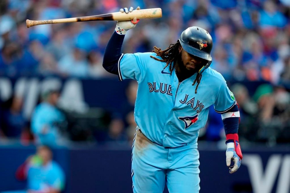 Toronto Blue Jays' Vladimir Guerrero Jr. (27) gestures with his bat after popping out during tenth inning American League MLB baseball action against the Tampa Bay Rays, in Toronto, Saturday, Sept. 30, 2023. THE CANADIAN PRESS/Frank Gunn