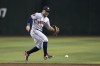 Houston Astros second baseman Jose Altuve runs over to field a grounder on an infield single hit by Arizona Diamondbacks' Tommy Pham during the third inning of a baseball game, Saturday, Sept. 30, 2023, in Phoenix. (AP Photo/Ross D. Franklin)
