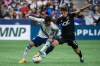 Vancouver Whitecaps midfielder Pedro Vite (45) and D.C. United midfielder Gabriel Pirani (10) fight for the ball during first half MLS action in Vancouver, B.C., Saturday, Sept. 30, 2023. THE CANADIAN PRESS/Ethan Cairns
