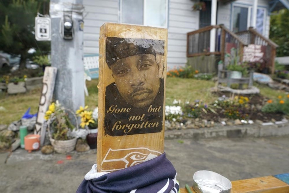 FILE - A sign is displayed on May 27, 2021, at a memorial in Tacoma, Wash., where Manuel