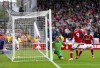 The ball hits the back of the net but VAR disallows it for an offside from Nottingham Forest's Taiwo Awoniyi, center, during their English Premier League soccer match against Brentford at City Ground, Nottingham, England, Sunday, Oct. 1, 2023. (Nigel French/PA via AP)