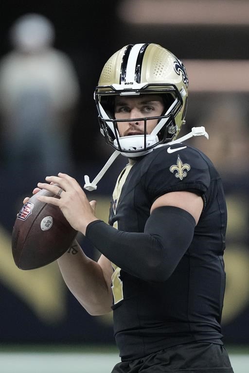 New Orleans Saints quarterback Derek Carr (4) looks to pass during warmups ahead of an NFL football game against the Tampa Bay Buccaneers, in New Orleans, Sunday, Oct. 1, 2023. (AP Photo/Gerald Herbert)