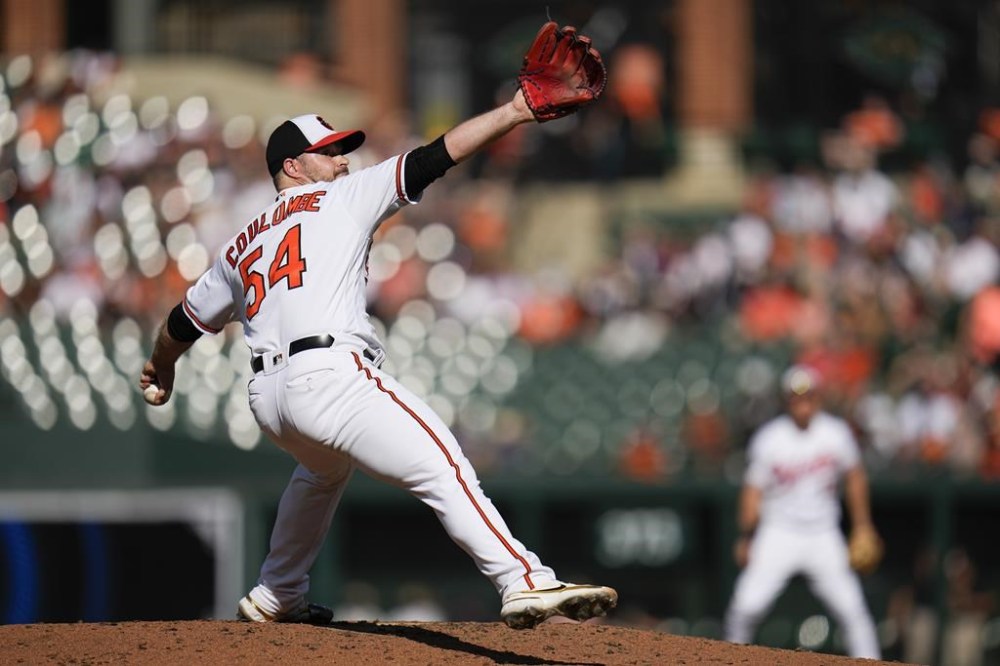 Baltimore Orioles' Danny Coulombe throws a pitch to the Boston Red Sox during the third inning of a baseball game, Sunday, Oct. 1, 2023, in Baltimore. (AP Photo/Julio Cortez)