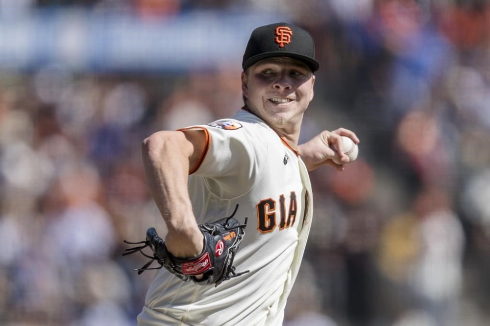 San Francisco Giants starting pitcher Kyle Harrison throws against a Los Angeles Dodgers batter during the first inning of a baseball game in San Francisco, Sunday, Oct. 1, 2023. (AP Photo/John Hefti)