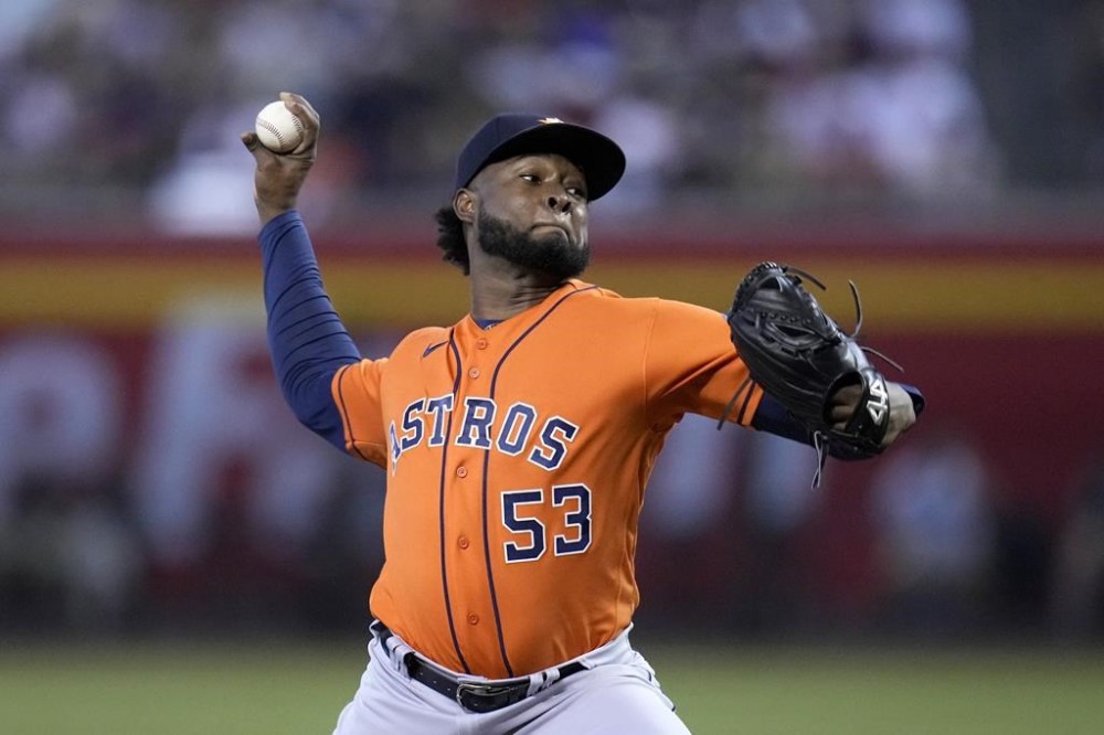 Houston Astros starting pitcher Cristian Javier throws against the Arizona Diamondbacks during the first inning of a baseball game, Sunday, Oct. 1, 2023, in Phoenix. (AP Photo/Ross D. Franklin)