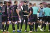 Bayern's head coach Thomas Tuchel, center, shakes hands with Joshua Kimmich after the German Bundesliga soccer match between Leipzig and Bayern Munich, at the Red Bull Arena stadium in Leipzig, Germany, Saturday, Sept. 30, 2023. The match ended in a 2-2 draw. (AP Photo/Matthias Schrader)