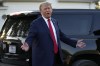 Former President Donald Trump speaks to reporters during a visit to the Vande Voort family farm, Sunday, Oct. 1, 2023, in Leighton, Iowa. (AP Photo/Charlie Neibergall)