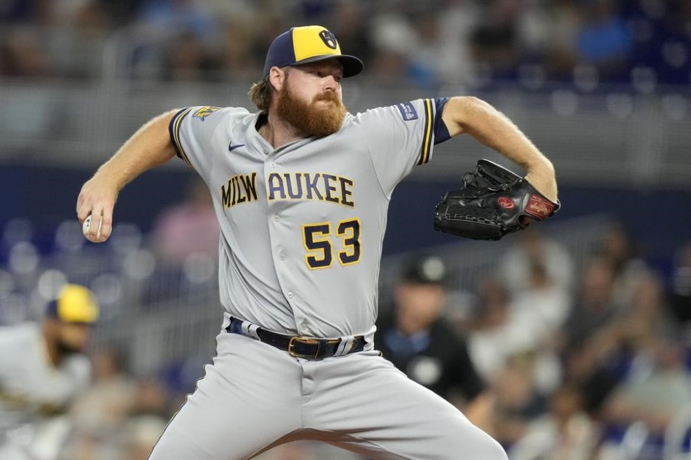 Milwaukee Brewers starting pitcher Brandon Woodruff throws during the first inning of a baseball game against the Miami Marlins, Saturday, Sept. 23, 2023, in Miami. (AP Photo/Lynne Sladky)