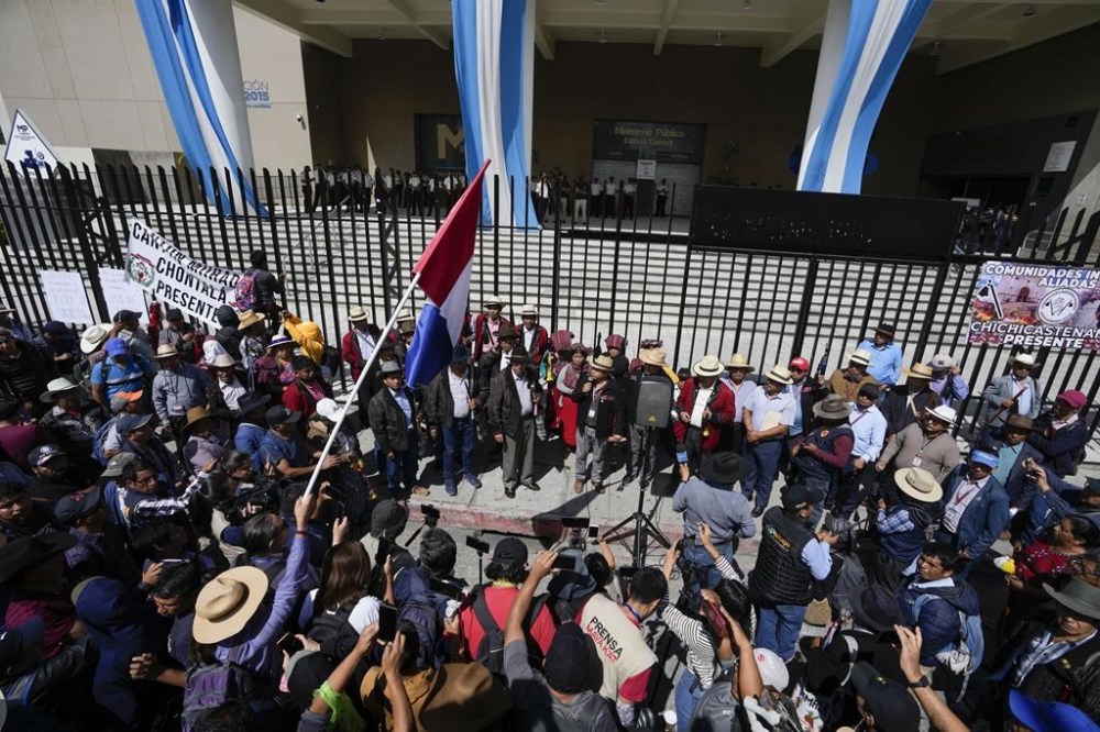 Protestors demand the resignation of Attorney General Consuelo Porras and prosecutor Rafael Curruchiche outside the Attorney General's Office in Guatemala City, Monday, Oct. 2, 2023. Indigenous organizations are blocking some roads across the country to protest the attorney general's latest raids on Guatemala’s top electoral tribunal after elections. (AP Photo/Moises Castillo)