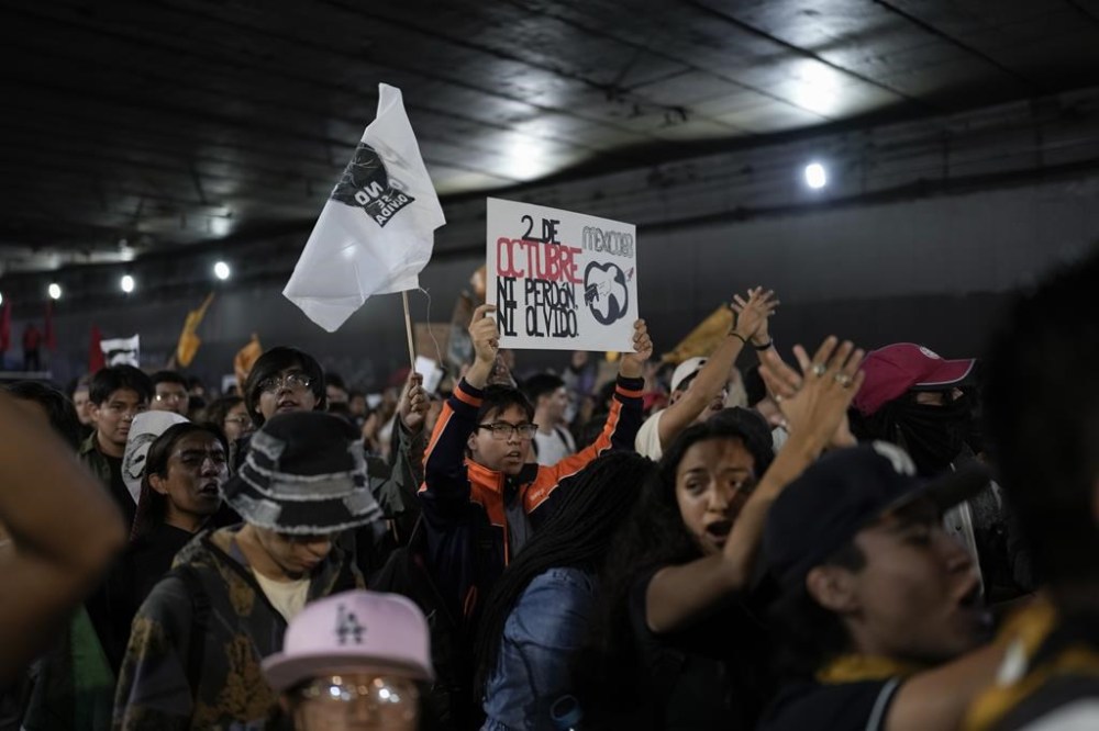 Demonstrators march to mark the 55th anniversary of the killings of student protesters at Tlatelolco plaza when soldiers opened fire on a peaceful demonstration, in Mexico City, Monday, Oct. 2. 2023. (AP Photo/Eduardo Verdugo)