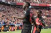 Leverkusen's scorer Victor Boniface, left, celebrates with Leverkusen's Jeremie Frimpong, right, after scoring the opening goal during the German Bundesliga soccer match between Bayer Leverkusen and FC Heidenheim in Leverkusen, Germany, Sunday, Sept. 24, 2023. (AP Photo/Martin Meissner)