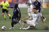 New England Revolution's Ema Boateng (18) gets past Toronto FC's Brandon Servania, right, during the first half of an MLS soccer match, Saturday, June 24, 2023, in Foxborough, Mass. THE CANADIAN PRESS/AP-Michael Dwyer
