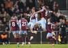 Burnley's Jacob Bruun Larsen, center, celebrates scoring against Luton Town during the English Premier League soccer match at Kenilworth Road, Luton, England, Tuesday Oct. 3, 2023. (Nigel French/PA via AP)