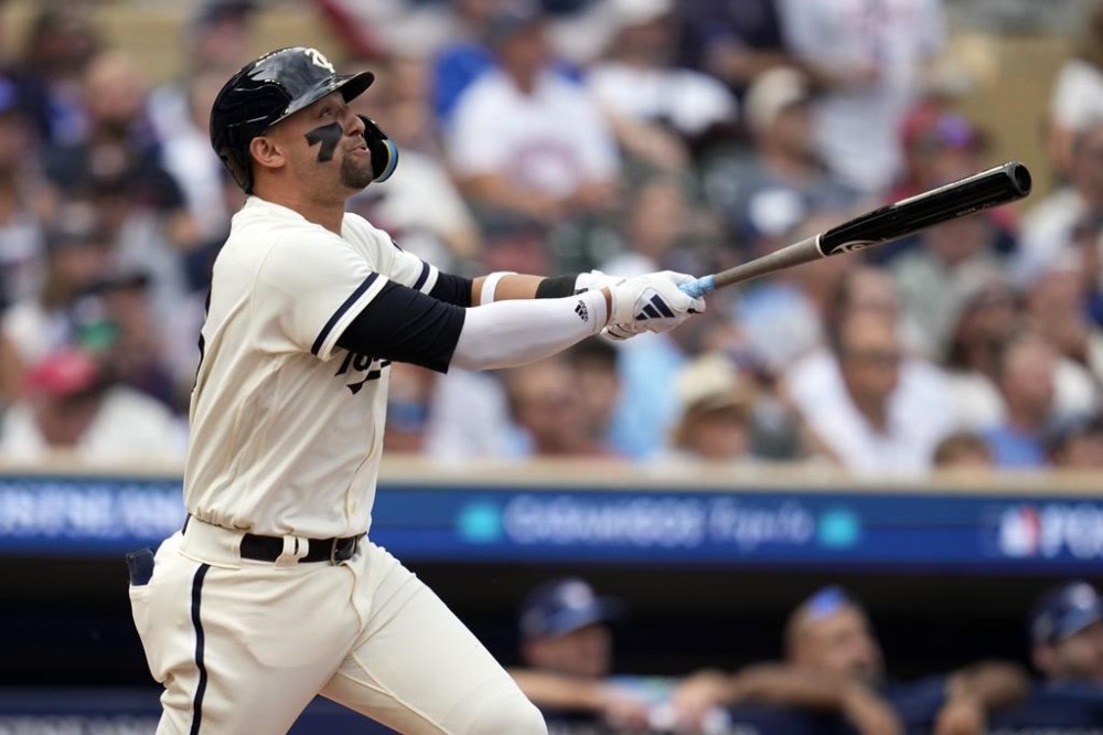 Minnesota Twins' Royce Lewis watches his solo home run during the third inning in Game 1 of an AL wild-card baseball playoff series against the Toronto Blue Jays Tuesday, Oct. 3, 2023, in Minneapolis. (AP Photo/Abbie Parr)