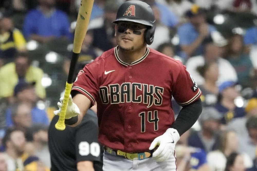 Arizona Diamondbacks' Gabriel Moreno reacts after hitting a home run during the fourth inning of a Game 1 of their National League wildcard baseball game against the Milwaukee Brewers Tuesday, Oct. 3, 2023, in Milwaukee. (AP Photo/Morry Gash)