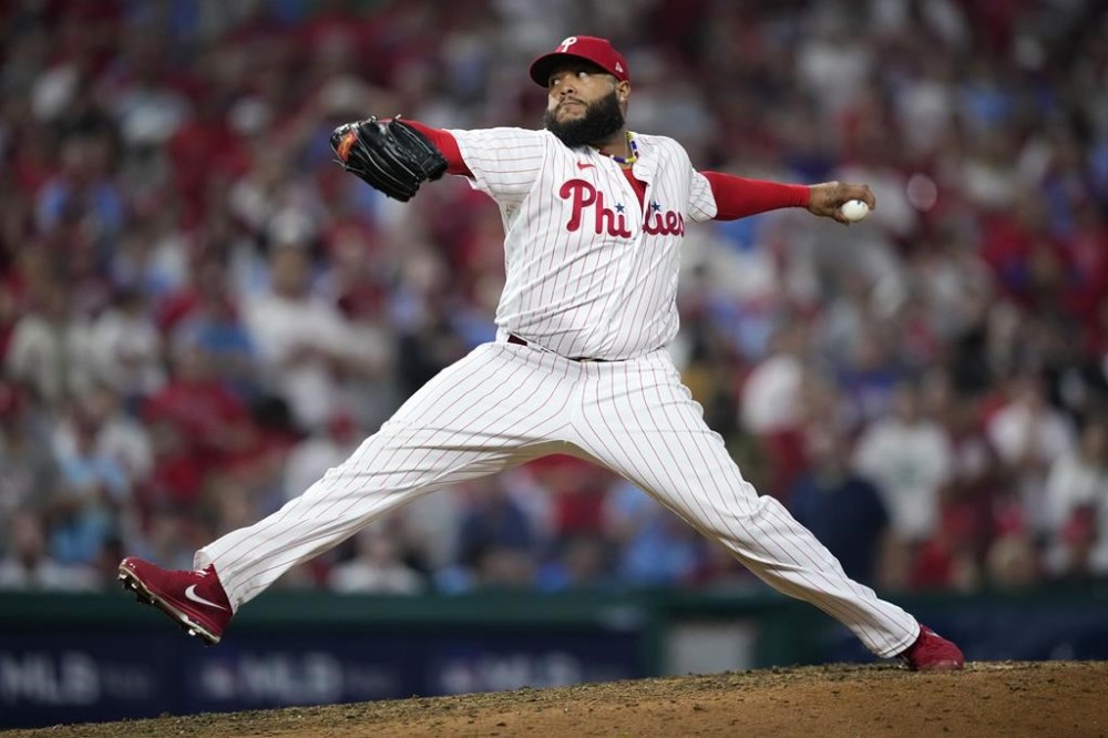 Philadelphia Phillies' Jose Alvarado pitches during the seventh inning of Game 1 in an NL wild-card baseball playoff series against the Miami Marlins, Tuesday, Oct. 3, 2023, in Philadelphia. (AP Photo/Matt Slocum)
