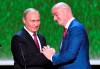 FILE - FIFA President Gianni Infantino, right, and Russian President Vladimir Putin greet each other as they attend a concert at the Bolshoi Theater in Moscow, Russia, on Saturday, July 14, 2018, at the close of the World Cup tournament. (Yuri Kadobnov/Pool Photo via AP, File)