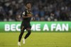 Real Madrid's Vinicius Junior celebrates after scoring his sides first goal during the Champions League group C soccer match between Napoli and Real Madrid at the Diego Armando Maradona stadium in Naples, Italy, Tuesday, Oct. 3, 2023. (AP Photo/Alessandra Tarantino)