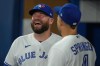 Blue Jays manager John Schneider was thrown a curveball Wednesday when his pre-game media availability was interrupted by a countrywide test of the emergency alert system. Schneider (left) shares a laugh with right fielder George Springer before American League MLB baseball action against the Houston Astros, in Toronto on Thursday, June 8, 2023. THE CANADIAN PRESS/Chris Young