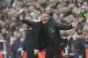 PSG's head coach Luis Enrique gives directions to his players during the Champions League group F soccer match between Newcastle and Paris Saint Germain at St. James' Park, Wednesday, Oct. 4, 2023, in Newcastle, England. (AP Photo/Scott Heppell)