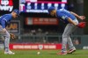 Toronto Blue Jays third baseman Matt Chapman, left, and pitcher Jose Berrios watch as a ground ball hit by Minnesota Twins' Royce Lewis rolls foul during the first inning of Game 2 of an AL wild-card baseball playoff series Wednesday, Oct. 4, 2023, in Minneapolis. (AP Photo/Bruce Kluckhohn)