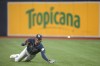 Tampa Bay Rays right fielder Josh Lowe dives but is unable to catch a ball in the fourth inning of Game 2 in an AL wild-card baseball playoff series against the Texas Rangers, Wednesday, Oct. 4, 2023, in St. Petersburg, Fla. (AP Photo/John Raoux)
