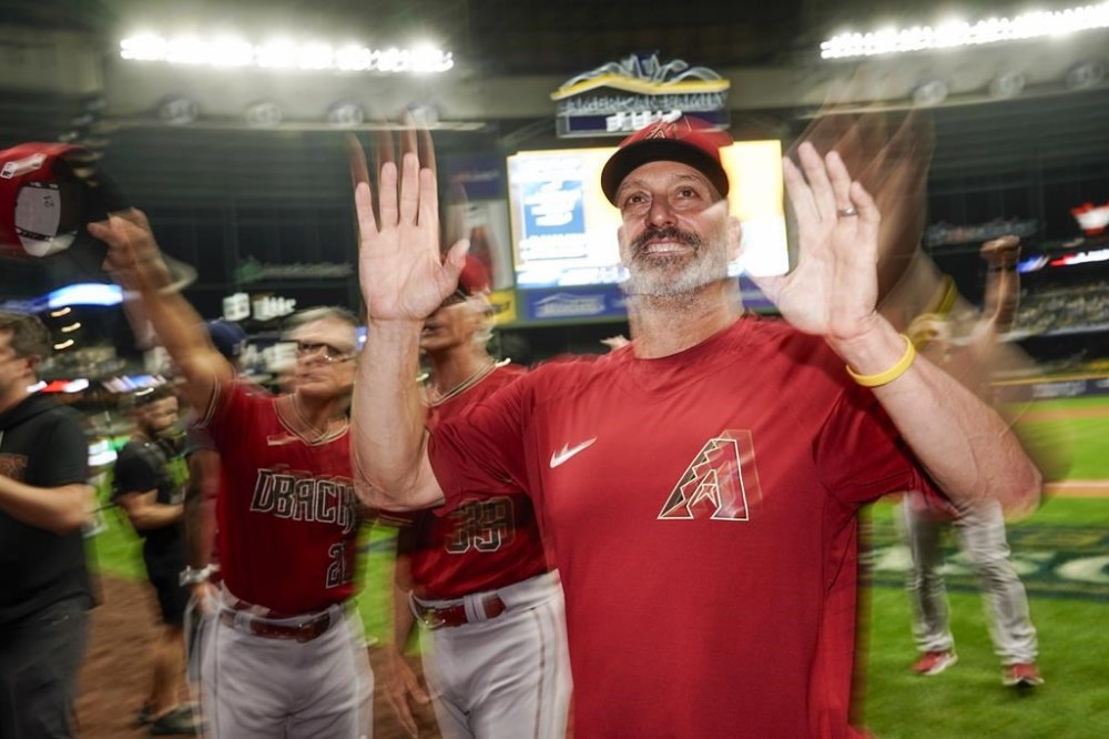 Arizona Diamondbacks manager Torey Lovullo celebrates after Game 2 of their National League wildcard baseball series against the Milwaukee Brewers Wednesday, Oct. 4, 2023, in Milwaukee. The Diamondbacks won 5-2 to win the series. (AP Photo/Morry Gash)