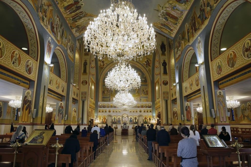 FILE - Christian worshippers take part in Sunday Mass at the Saint Nicolas Church in Beirut, Lebanon, Sunday, May 10, 2020. In the Middle East and North Africa, where religion is often ingrained in daily life's very fabric, rejecting faith can come with social or other repercussions, so many of the